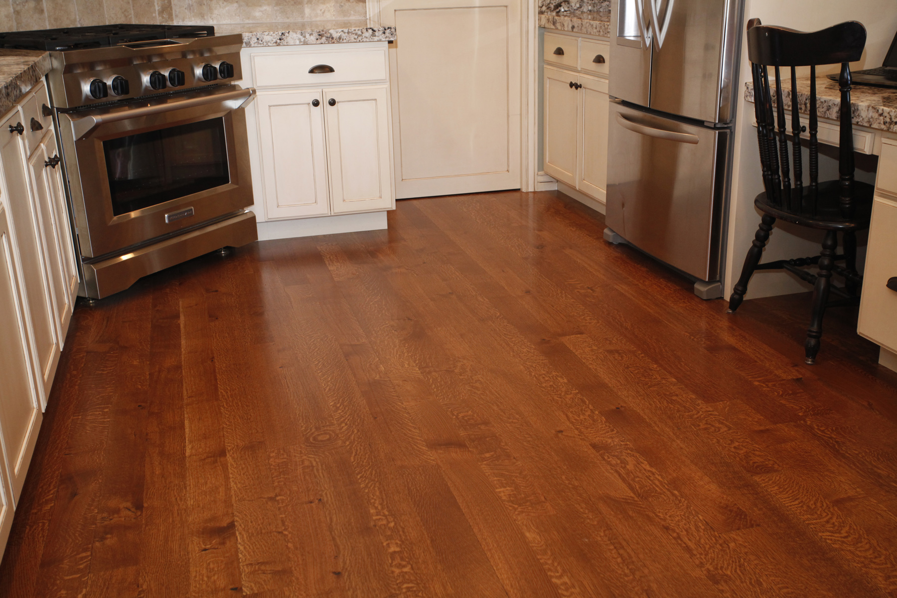 kitchen with hardwood floor light countertops